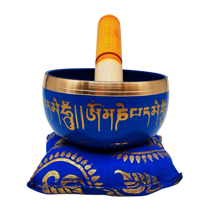 Tibetan singing bowl with blue cushion and striker, front view